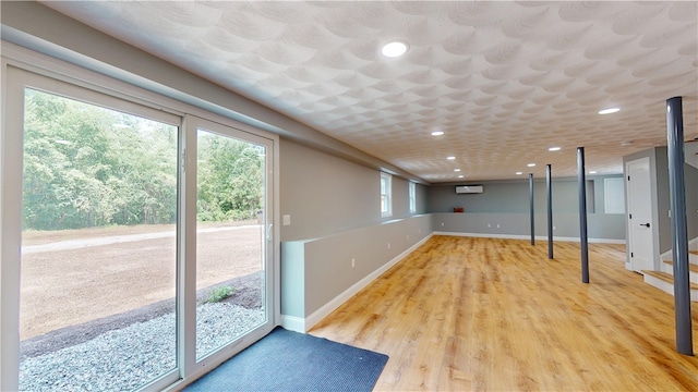 112 Cranberry Ridge Rd, Glocester, RI 02857 - below grade area featuring recessed lighting, an AC wall unit, and light wood-style floors