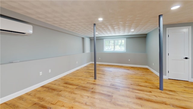 112 Cranberry Ridge Rd, Glocester, RI 02857 - basement with a wall mounted air conditioner, recessed lighting, and wood finished floors