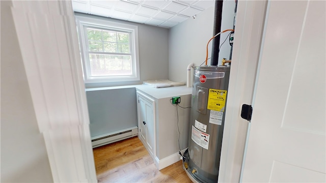 112 Cranberry Ridge Rd, Glocester, RI 02857 - utility room featuring a baseboard heating unit and electric water heater