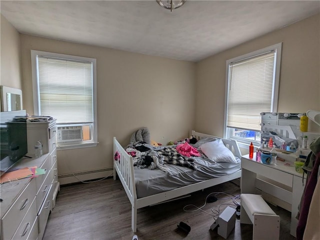 60 Sherman St, Pawtucket, RI 02860 - bedroom featuring a baseboard heating unit, multiple windows, cooling unit, and wood finished floors