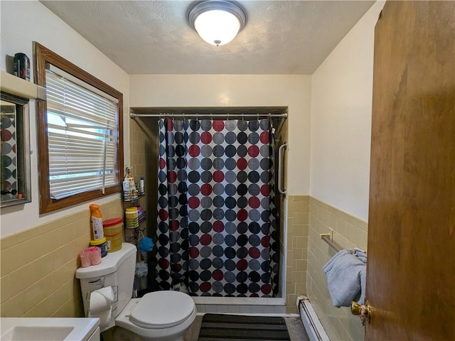 60 Sherman St, Pawtucket, RI 02860 - bathroom with tile walls, baseboard heating, curtained shower, and wainscoting