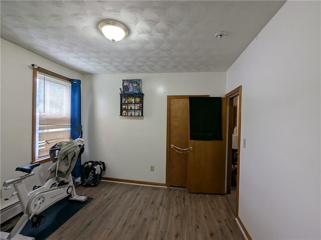 60 Sherman St, Pawtucket, RI 02860 - exercise area featuring wood finished floors and baseboards