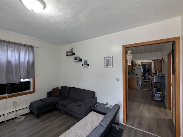 60 Sherman St, Pawtucket, RI 02860 - living area with wood finished floors, baseboard heating, and cooling unit