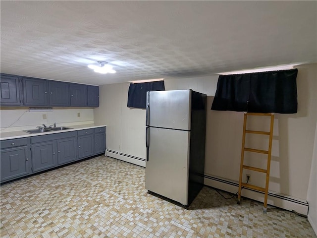 60 Sherman St, Pawtucket, RI 02860 - kitchen featuring freestanding refrigerator, baseboard heating, light countertops, a textured ceiling, and gray cabinets