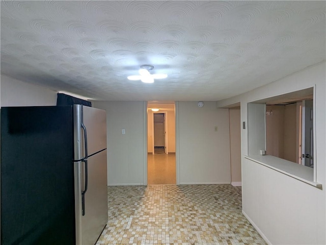 60 Sherman St, Pawtucket, RI 02860 - kitchen with freestanding refrigerator, light floors, light countertops, and a textured ceiling
