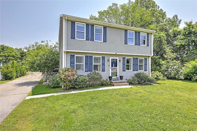 827 Anthony Rd, Portsmouth, RI 02871 - colonial-style house featuring a front lawn and driveway