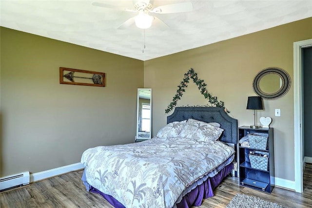 827 Anthony Rd, Portsmouth, RI 02871 - bedroom with wood finished floors, a baseboard radiator, and a ceiling fan