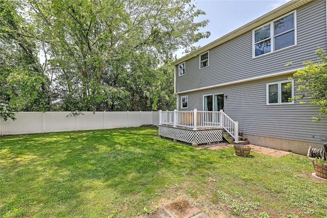 827 Anthony Rd, Portsmouth, RI 02871 - fenced backyard featuring a wooden deck