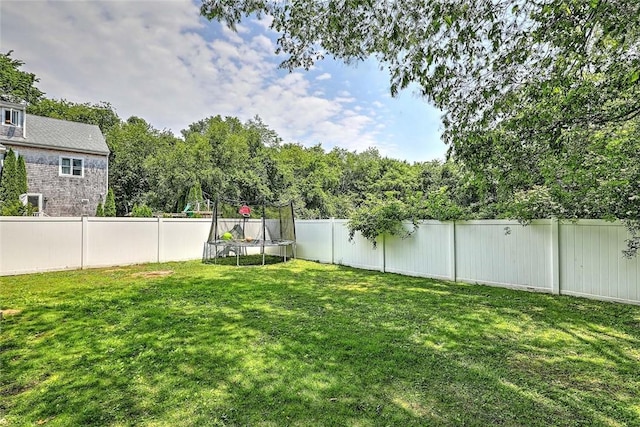 827 Anthony Rd, Portsmouth, RI 02871 - fenced backyard with a trampoline