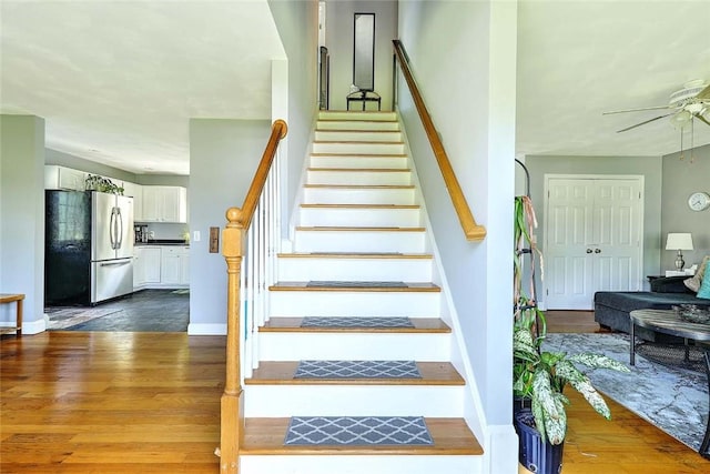 827 Anthony Rd, Portsmouth, RI 02871 - staircase with ceiling fan and wood finished floors