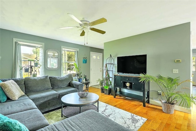 827 Anthony Rd, Portsmouth, RI 02871 - living area with ceiling fan and light wood-style floors