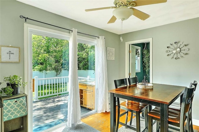 827 Anthony Rd, Portsmouth, RI 02871 - dining room featuring plenty of natural light, light wood finished floors, and a ceiling fan