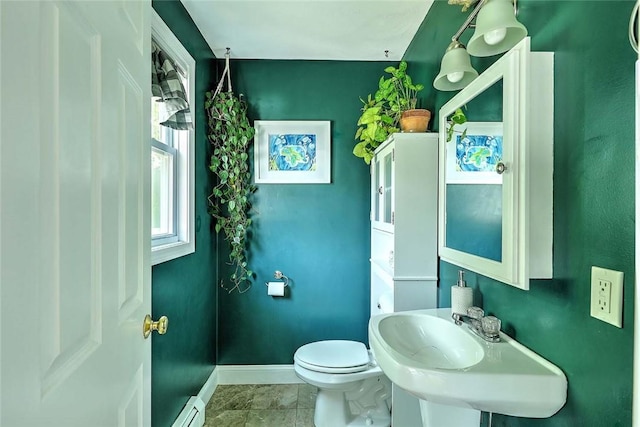 827 Anthony Rd, Portsmouth, RI 02871 - half bathroom with baseboard heating and marble look tile flooring