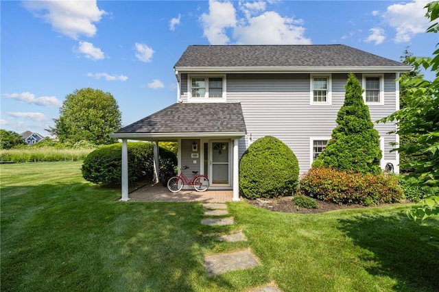 109 Corey Ln, Middletown, RI 02842 - rear view of house with a lawn, roof with shingles, and covered porch