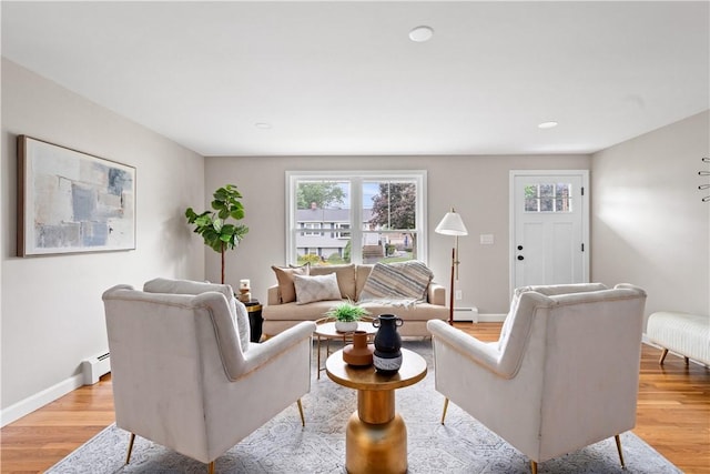 60 Webb Ave, Warwick, RI 02889 - living room featuring light wood-style floors, healthy amount of natural light, a baseboard heating unit, and recessed lighting