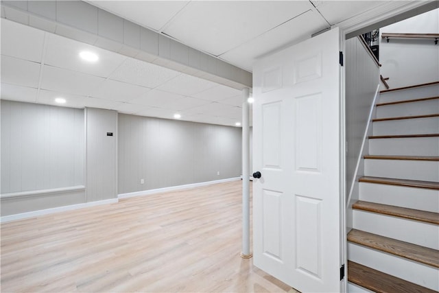 60 Webb Ave, Warwick, RI 02889 - finished below grade area with light wood-style flooring, stairway, a drop ceiling, and recessed lighting