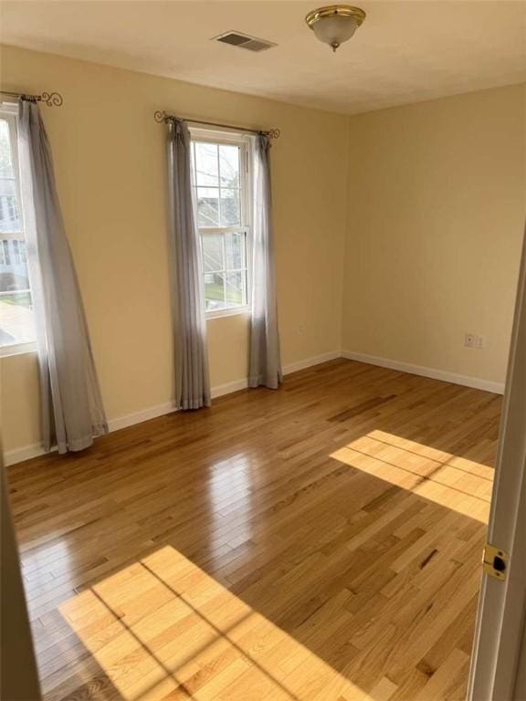 30 Hoover St, West Warwick, RI 02893 - spare room with plenty of natural light and light wood-style floors