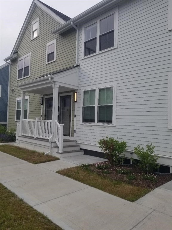 28 Portland St, Providence, RI 02907 - view of front facade featuring covered porch
