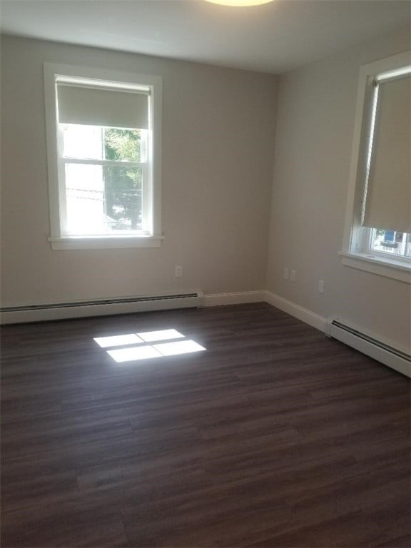 28 Portland St, Providence, RI 02907 - unfurnished room with a baseboard radiator and dark wood-type flooring