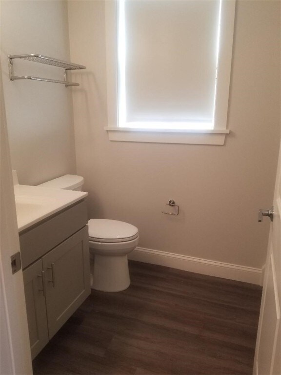 28 Portland St, Providence, RI 02907 - half bath with vanity and wood finished floors