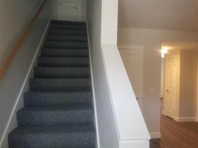 28 Portland St, Providence, RI 02907 - staircase featuring wood finished floors and baseboards