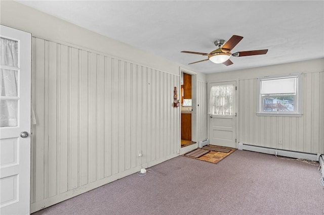 122 Cannon St, Cranston, RI 02920 - foyer entrance with a baseboard heating unit, carpet floors, ceiling fan, and a baseboard radiator