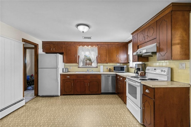 122 Cannon St, Cranston, RI 02920 - kitchen with appliances with stainless steel finishes, exhaust hood, a baseboard heating unit, and light countertops