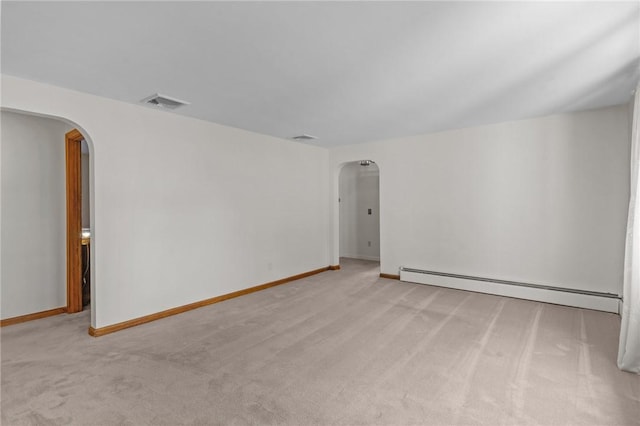 122 Cannon St, Cranston, RI 02920 - spare room with arched walkways, a baseboard radiator, and carpet