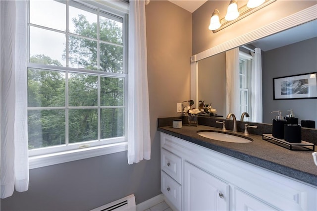 31 Wickaboxet Dr, West Greenwich, RI 02817 - bathroom with vanity and a baseboard radiator