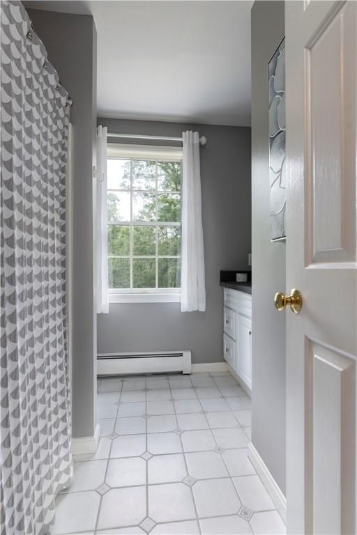 31 Wickaboxet Dr, West Greenwich, RI 02817 - bathroom featuring a baseboard radiator, vanity, and curtained shower