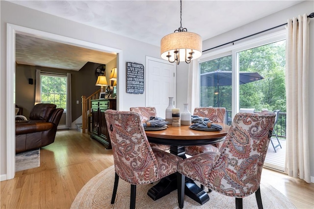 31 Wickaboxet Dr, West Greenwich, RI 02817 - dining space featuring a chandelier and light wood-type flooring