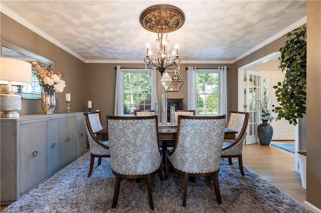 31 Wickaboxet Dr, West Greenwich, RI 02817 - dining room with a chandelier, wood finished floors, and ornamental molding