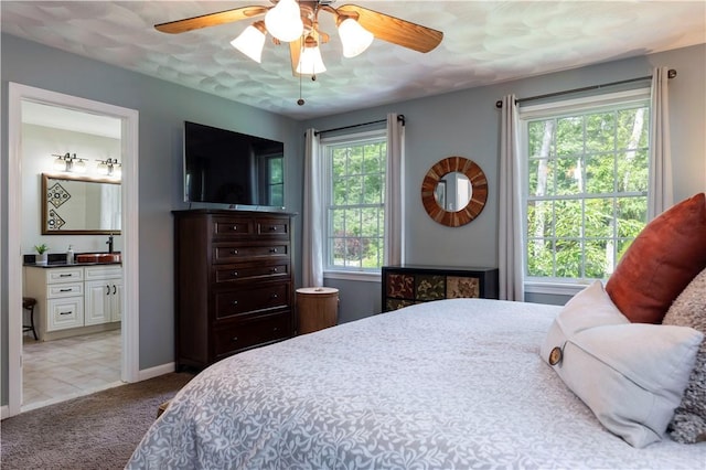 31 Wickaboxet Dr, West Greenwich, RI 02817 - bedroom with light carpet, connected bathroom, and a ceiling fan