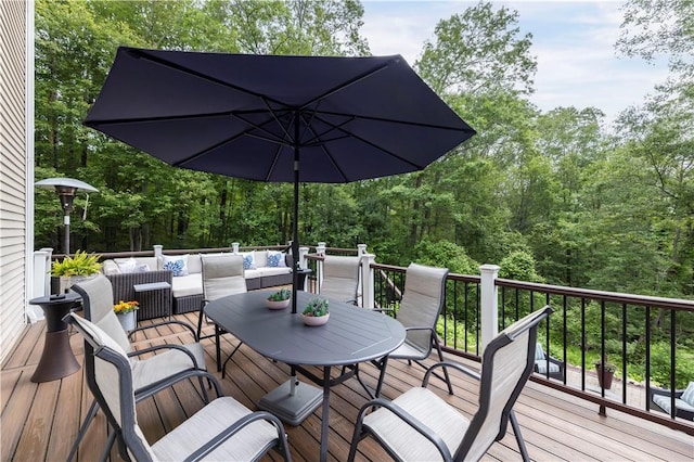 31 Wickaboxet Dr, West Greenwich, RI 02817 - wooden deck featuring an outdoor hangout area, outdoor dining space, and a view of trees