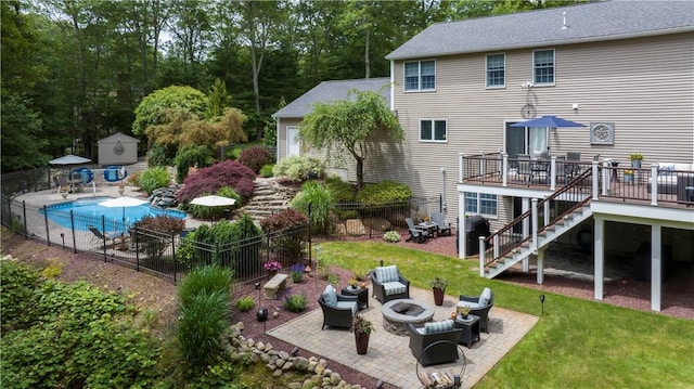 31 Wickaboxet Dr, West Greenwich, RI 02817 - rear view of property with an outdoor fire pit, a patio, stairs, a deck, and a shed