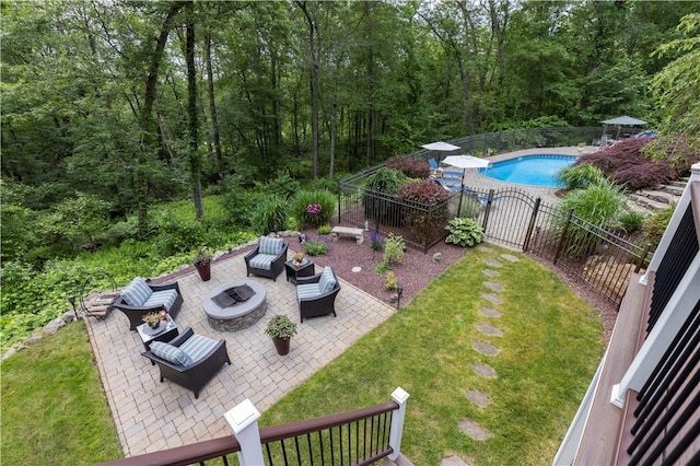 31 Wickaboxet Dr, West Greenwich, RI 02817 - view of yard featuring a patio, an outdoor living space with a fire pit, and a view of trees