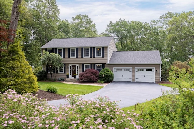 31 Wickaboxet Dr, West Greenwich, RI 02817 - colonial inspired home with an attached garage, driveway, and a front yard