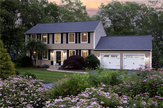 31 Wickaboxet Dr, West Greenwich, RI 02817 - colonial house featuring a garage, a front lawn, and a shingled roof