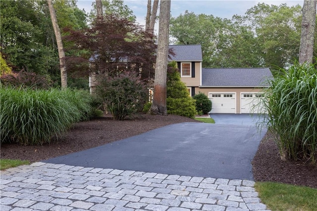 31 Wickaboxet Dr, West Greenwich, RI 02817 - view of front of home with concrete driveway and a garage
