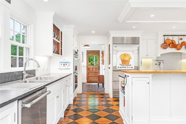 1049 Matunuck Schoolhouse Rd, South Kingstown, RI 02879 - kitchen with appliances with stainless steel finishes, plenty of natural light, white cabinetry, and recessed lighting