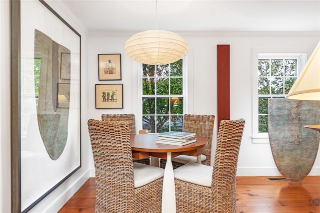 1049 Matunuck Schoolhouse Rd, South Kingstown, RI 02879 - dining space with wood-type flooring and ornamental molding