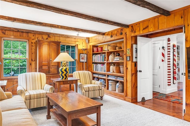 1049 Matunuck Schoolhouse Rd, South Kingstown, RI 02879 - living room featuring wood walls, beam ceiling, and wood finished floors