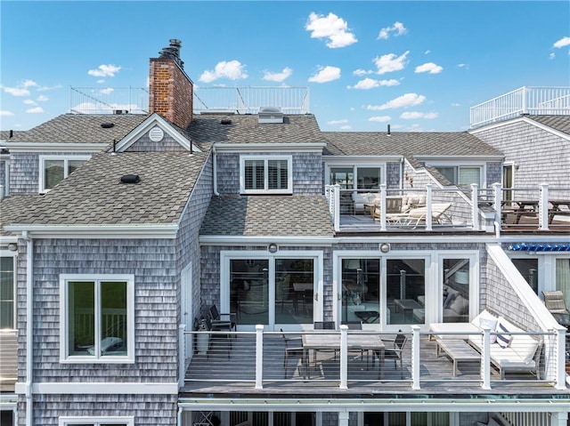 31 Coddington Unit 24, Newport, RI 02840 - rear view of house with a balcony, a shingled roof, and a chimney