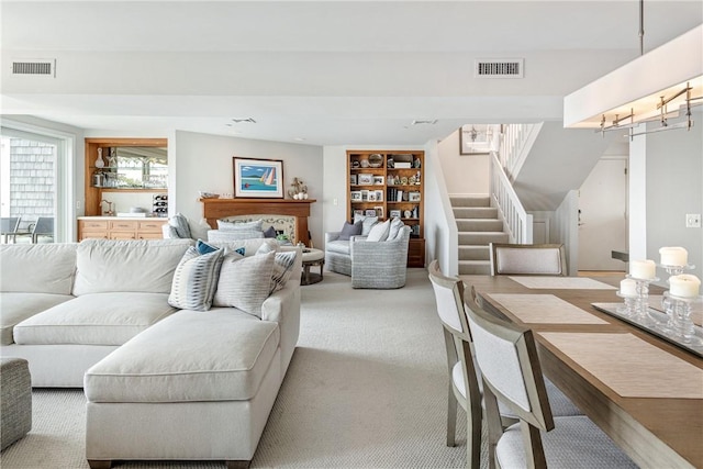 31 Coddington Unit 24, Newport, RI 02840 - living room with carpet, stairway, and built in features
