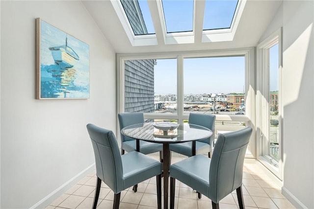 31 Coddington Unit 24, Newport, RI 02840 - dining area with healthy amount of natural light, lofted ceiling, light tile patterned flooring, and a skylight