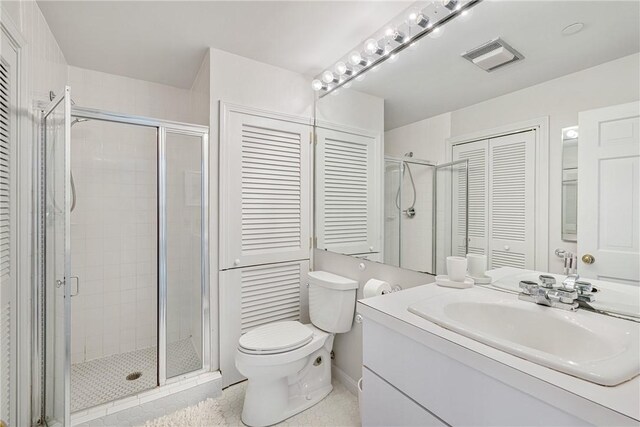 31 Coddington Unit 24, Newport, RI 02840 - full bath with a closet, vanity, a stall shower, and tile patterned flooring