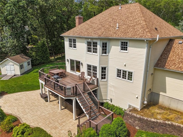 6 Jasons Grant Dr, Cumberland, RI 02864 - rear view of house with a patio, a chimney, a deck, a storage shed, and a lawn