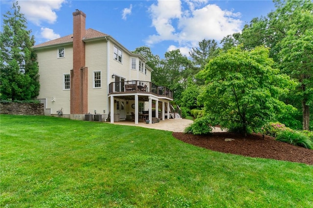 6 Jasons Grant Dr, Cumberland, RI 02864 - back of property featuring a deck, a patio, a chimney, and a yard