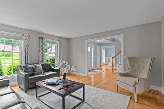 6 Jasons Grant Dr, Cumberland, RI 02864 - living room featuring plenty of natural light, light wood finished floors, and stairs