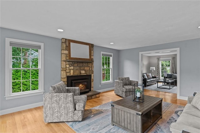 6 Jasons Grant Dr, Cumberland, RI 02864 - living area with healthy amount of natural light, a fireplace, wood finished floors, and recessed lighting